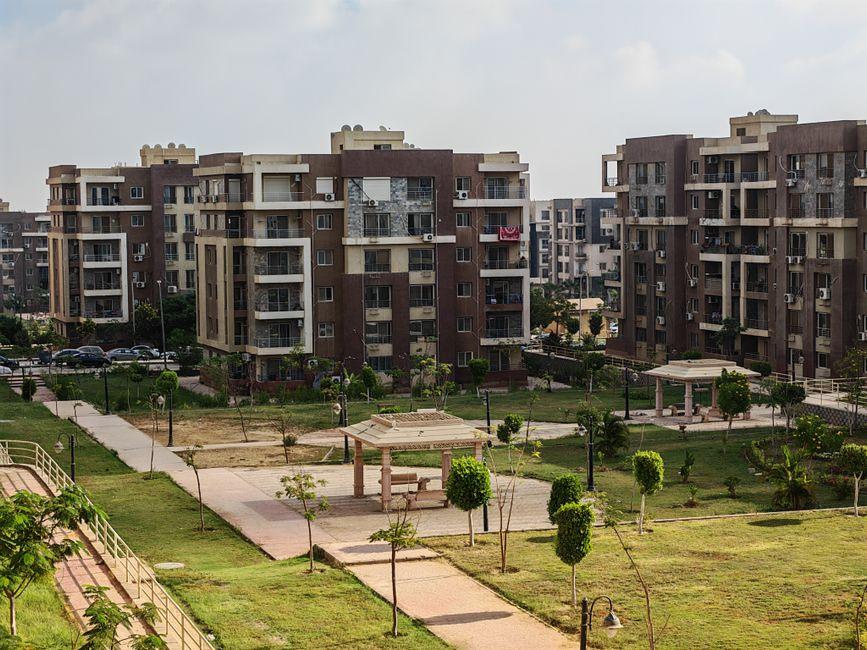 Modern Apartment Complex with Green Urban Park